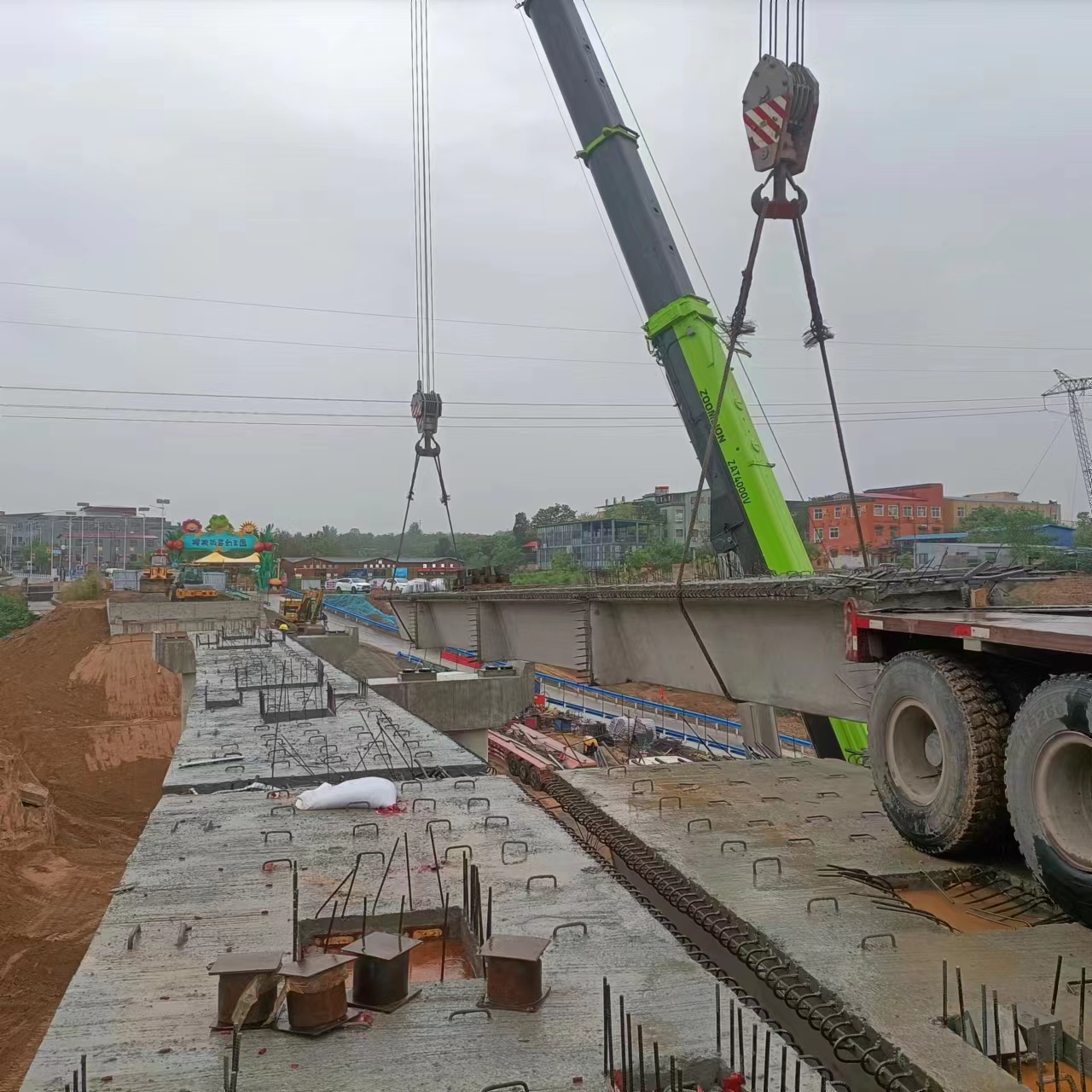 Crane placing a precast bridge girder
